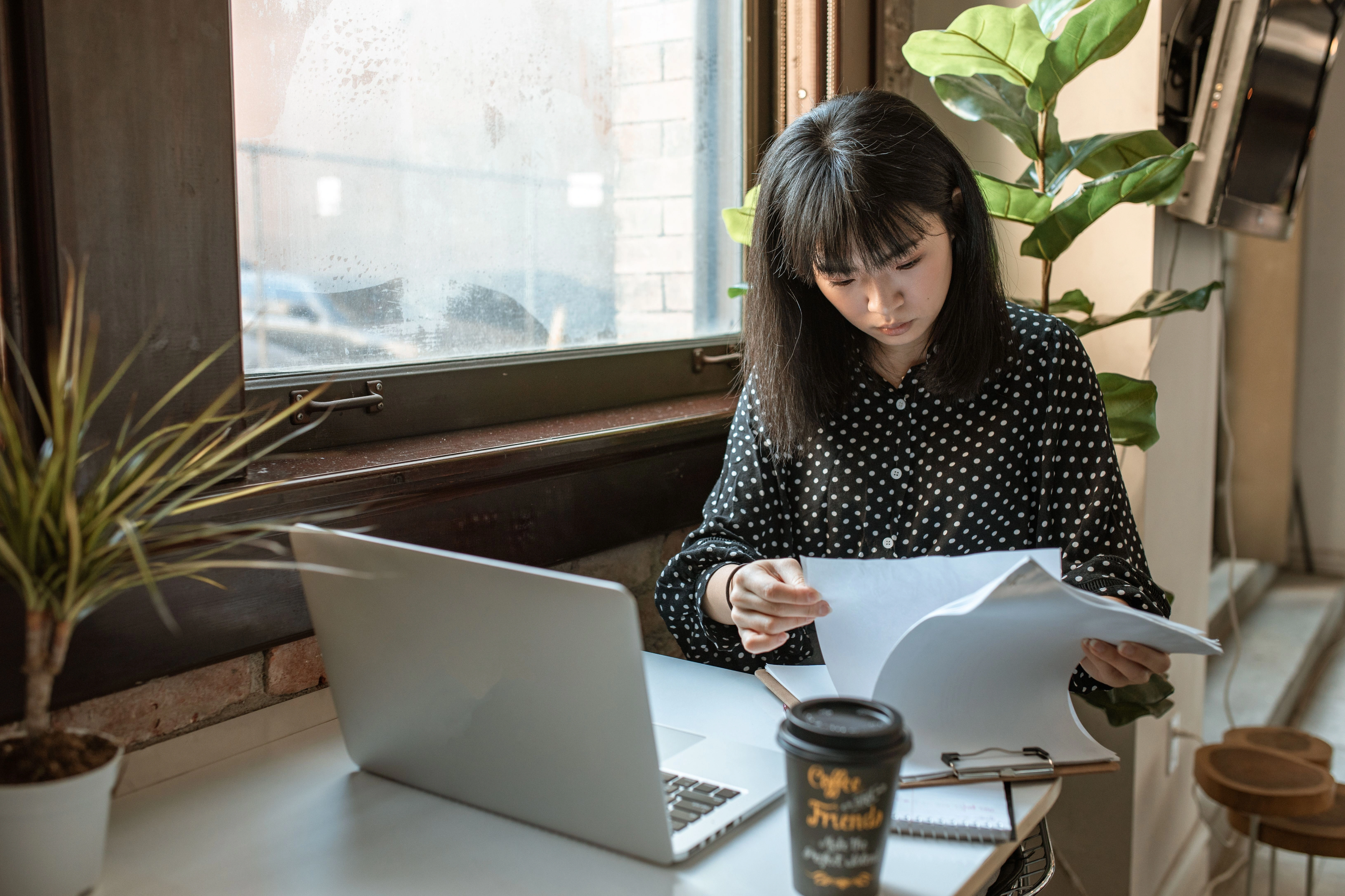 Bookkeeping Service Contract Agreement being reviewed by a small business owner and a professional bookkeeper