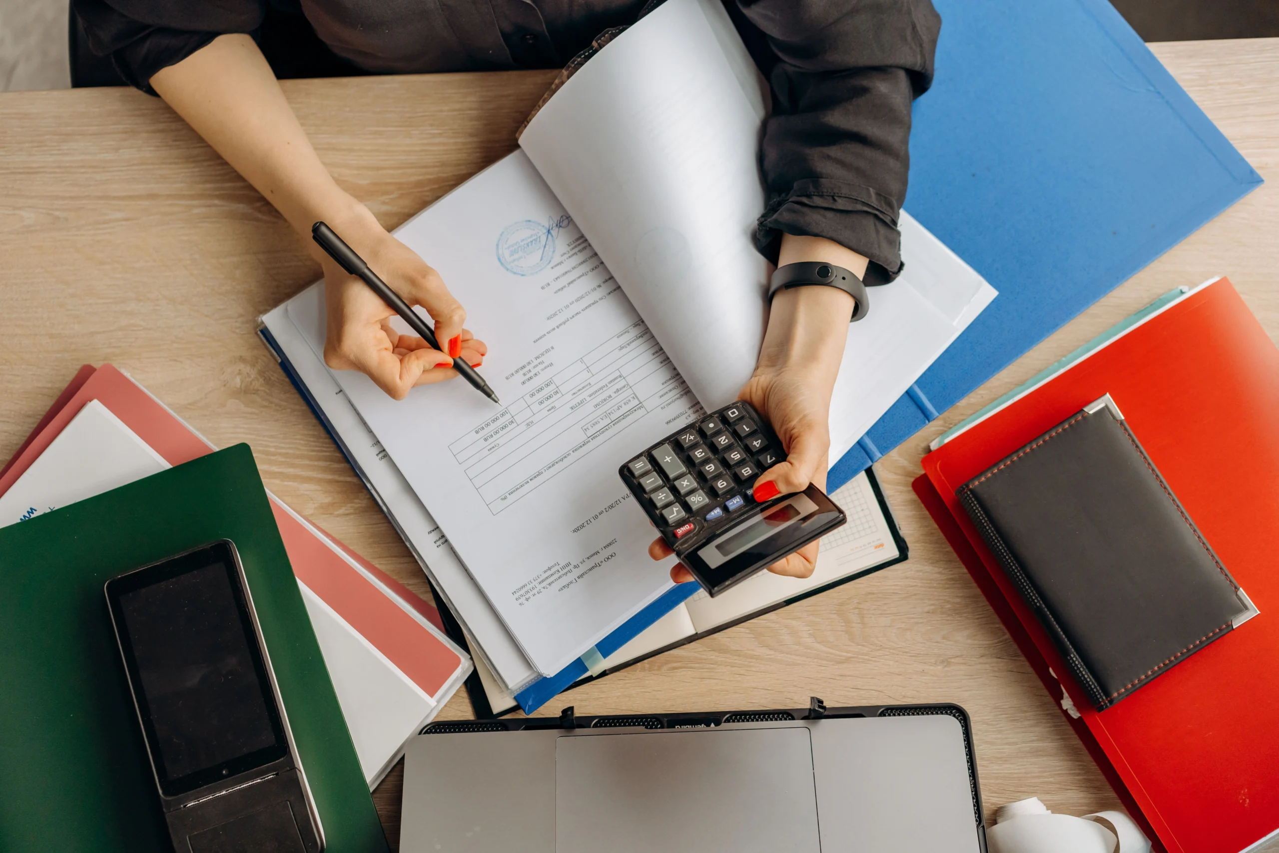 CFO Services for Small Business, helping a business owner review financial reports and growth strategies